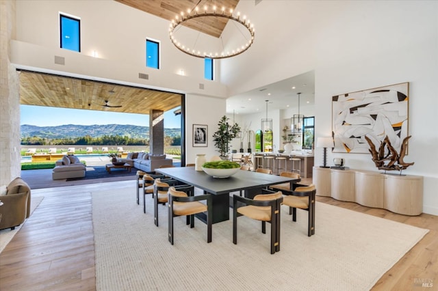 2350 Big Ranch Rd, Napa, CA 94558 - dining space featuring a high ceiling, light wood finished floors, a chandelier, and a mountain view