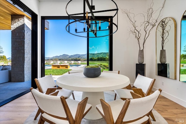 2350 Big Ranch Rd, Napa, CA 94558 - dining space featuring a chandelier, plenty of natural light, a mountain view, and light wood-type flooring