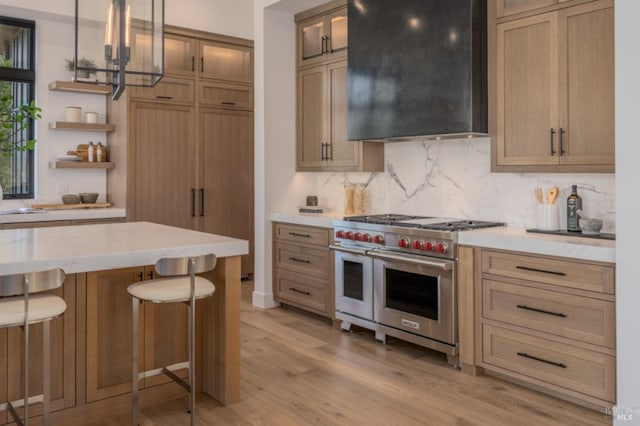 2350 Big Ranch Rd, Napa, CA 94558 - kitchen featuring double oven range, open shelves, light wood finished floors, decorative backsplash, and a breakfast bar area