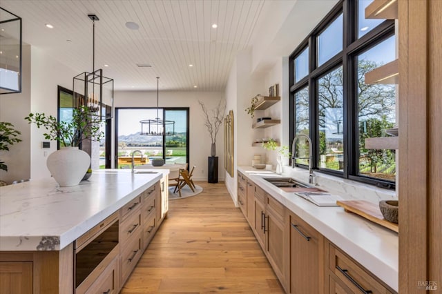 2350 Big Ranch Rd, Napa, CA 94558 - kitchen with a sink, stainless steel microwave, light wood-type flooring, a large island with sink, and recessed lighting