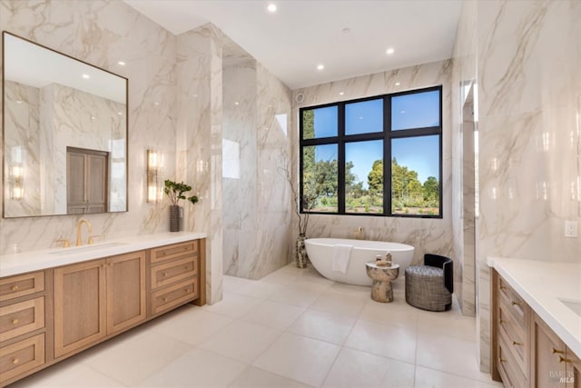 2350 Big Ranch Rd, Napa, CA 94558 - bathroom with tile walls, vanity, a freestanding tub, and recessed lighting