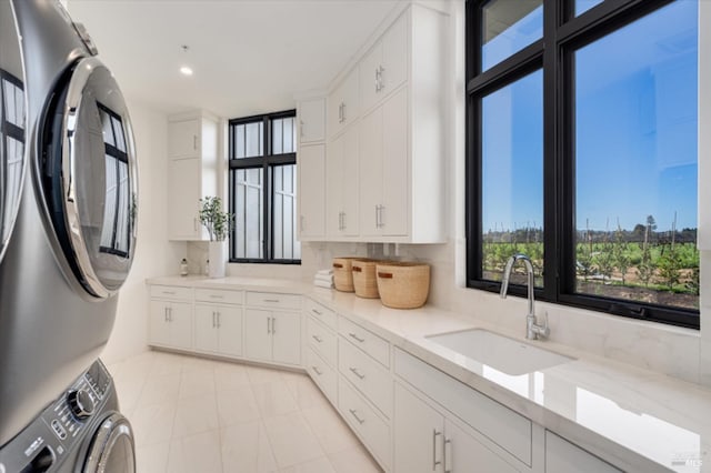 2350 Big Ranch Rd, Napa, CA 94558 - kitchen featuring a sink, stacked washer / dryer, white cabinetry, light stone countertops, and recessed lighting