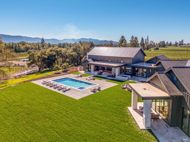 2350 Big Ranch Rd, Napa, CA 94558 - rear view of property featuring a patio area, an in-ground hot tub, an outdoor pool, and a yard
