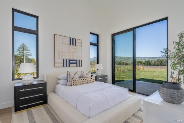 2350 Big Ranch Rd, Napa, CA 94558 - bedroom with access to outside and light wood finished floors