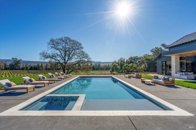 2350 Big Ranch Rd, Napa, CA 94558 - view of swimming pool featuring an outdoor hangout area, a patio, a pool with connected hot tub, and a mountain view