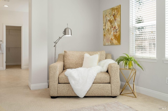 living area featuring baseboards, carpet flooring, and recessed lighting