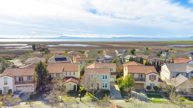 bird's eye view with a residential view and a mountain view