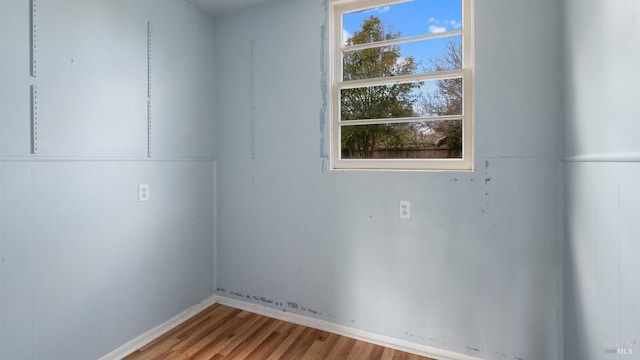 unfurnished room featuring wood finished floors