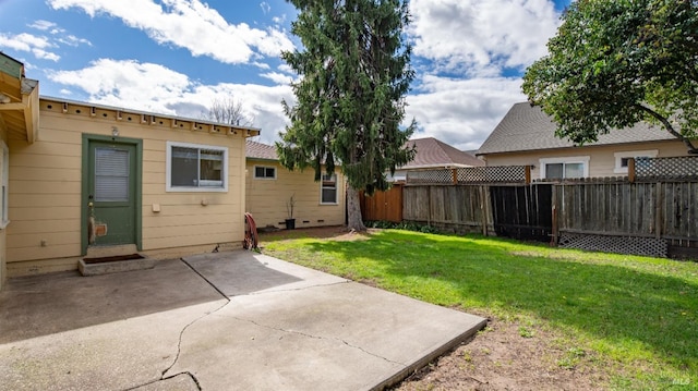 view of yard featuring a patio area and a fenced backyard