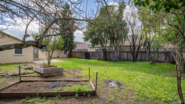 view of yard featuring a garden and fence