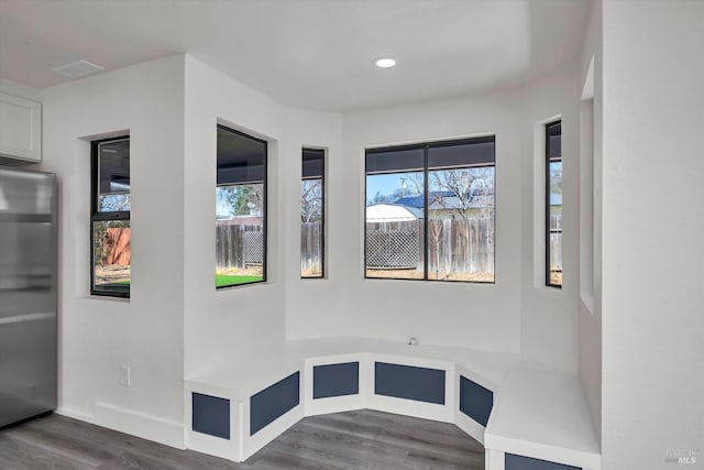 interior space featuring recessed lighting, visible vents, baseboards, and wood finished floors