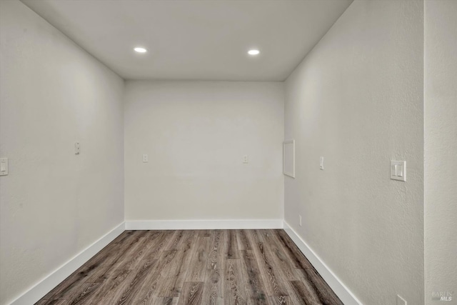 interior space with recessed lighting, baseboards, and wood finished floors