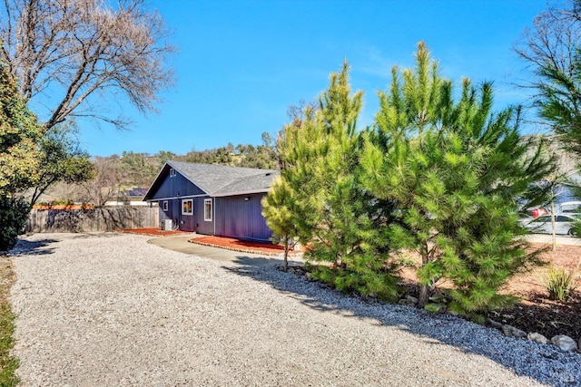 view of front of property featuring fence