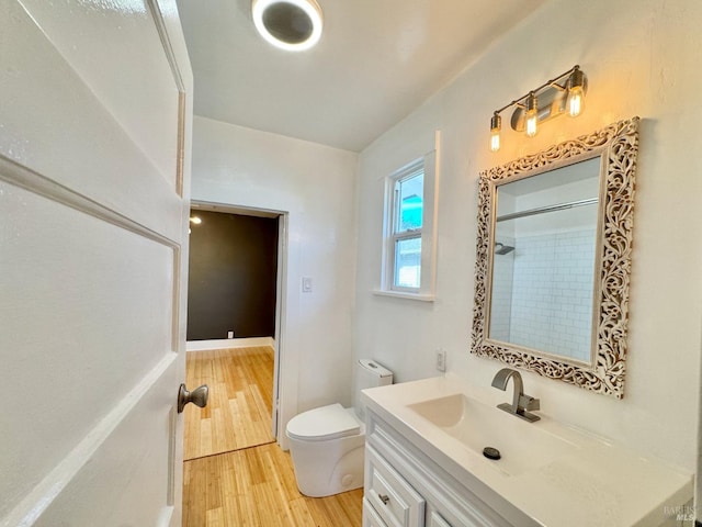 full bathroom with walk in shower, vanity, toilet, and wood finished floors