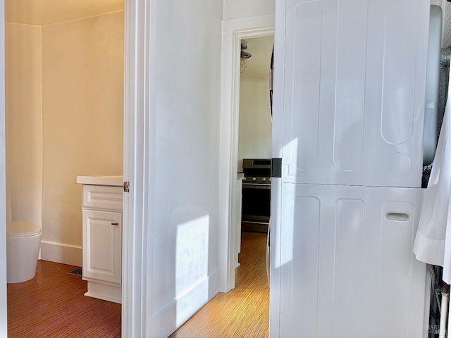 bathroom featuring wood finished floors and baseboards