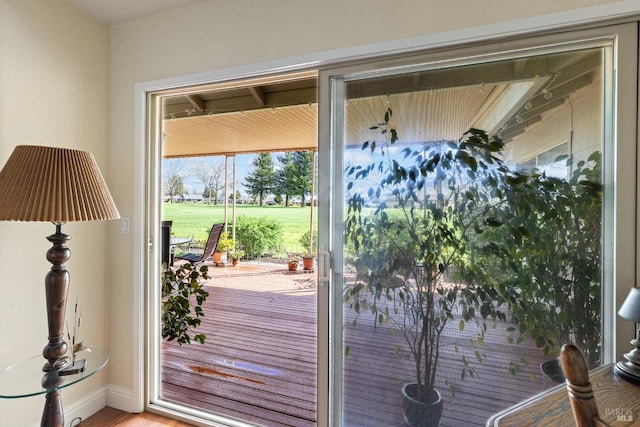 doorway to outside featuring wood finished floors