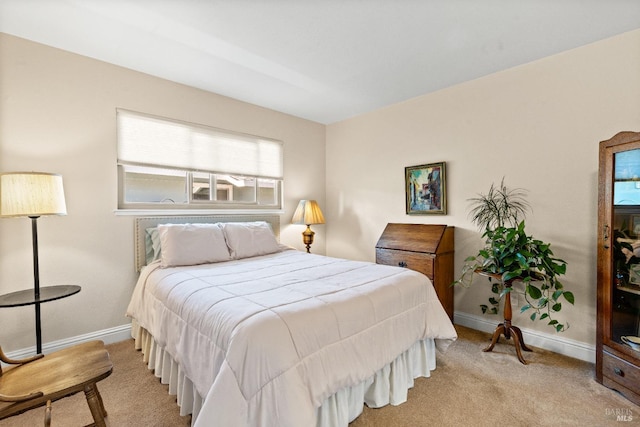 bedroom with carpet flooring and baseboards