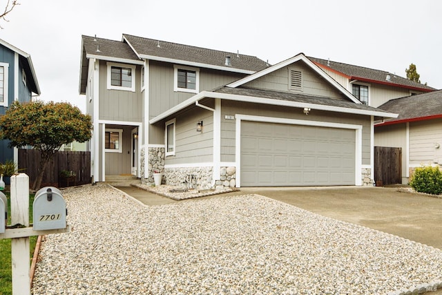 view of front of property featuring a garage, fence, stone siding, concrete driveway, and roof with shingles