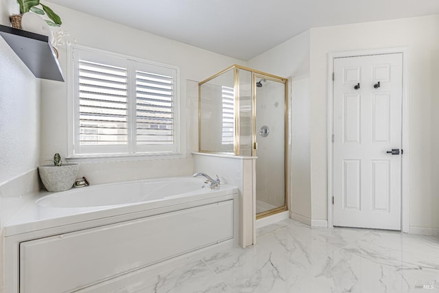 full bathroom featuring marble finish floor, a stall shower, a bath, and baseboards