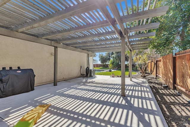 view of patio / terrace with a fenced backyard, grilling area, and a pergola