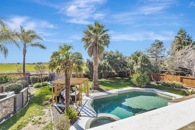 view of pool featuring a fenced backyard, a fenced in pool, a lawn, and an in ground hot tub