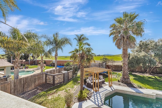 view of swimming pool with a fenced backyard, a fenced in pool, and a patio