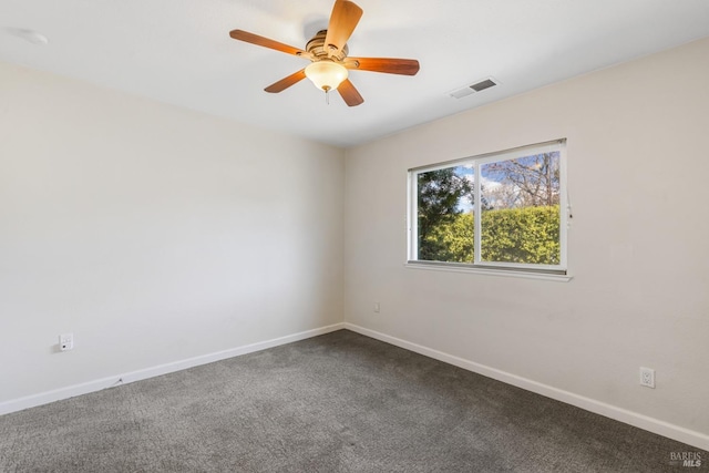 unfurnished room with ceiling fan, baseboards, visible vents, and dark colored carpet