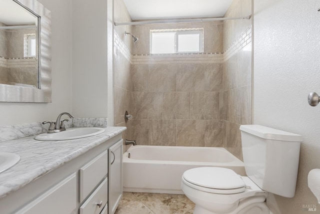 bathroom featuring toilet, tile patterned flooring, vanity, and shower / bathtub combination