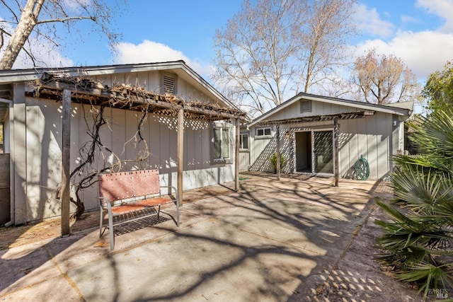 rear view of house featuring a patio