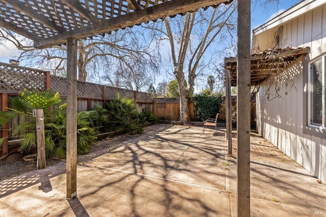 view of patio / terrace featuring a fenced backyard and a pergola