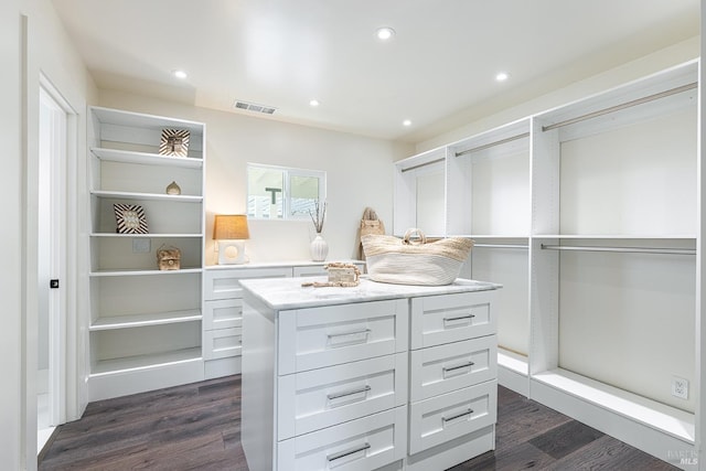 spacious closet featuring dark wood-style floors and visible vents