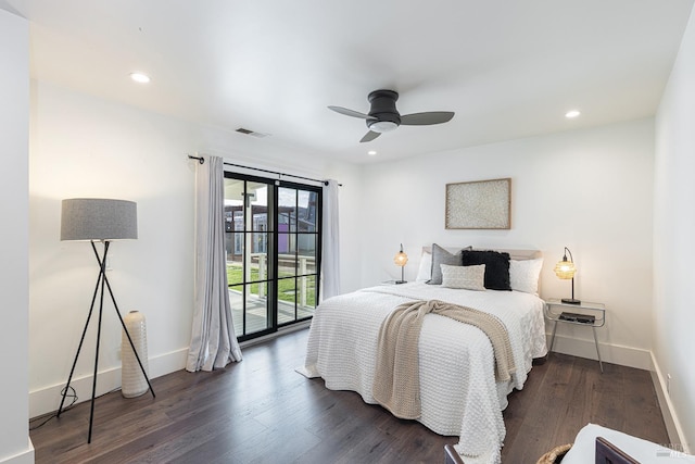 bedroom with dark wood-style floors, access to outside, visible vents, and baseboards