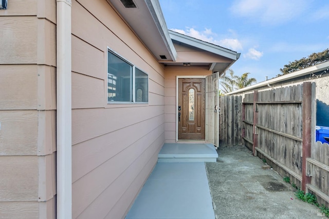 property entrance with fence