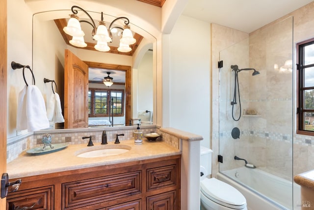 full bathroom featuring enclosed tub / shower combo, backsplash, toilet, and vanity