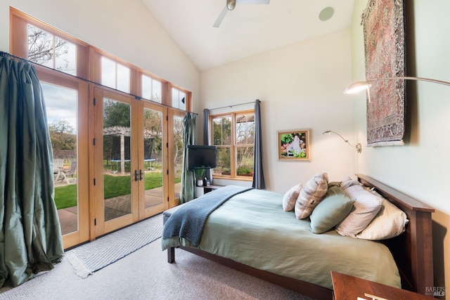 bedroom with carpet floors, high vaulted ceiling, ceiling fan, french doors, and access to outside