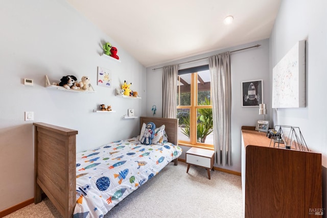 bedroom featuring baseboards and carpet floors