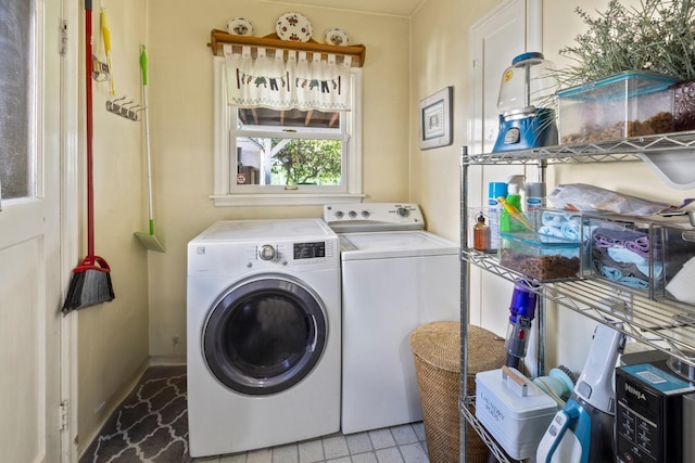 washroom featuring laundry area and washing machine and dryer