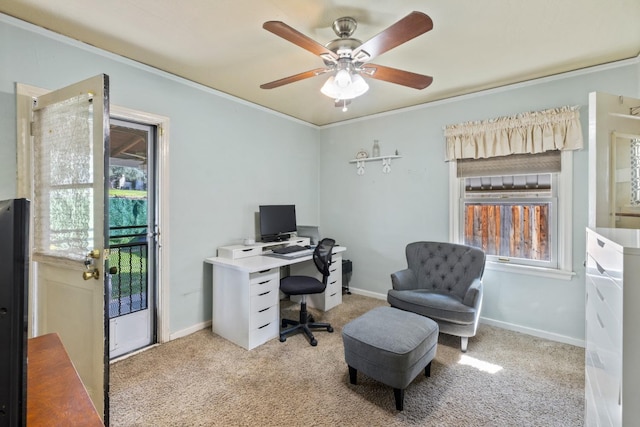 office featuring plenty of natural light, ornamental molding, ceiling fan, and light colored carpet