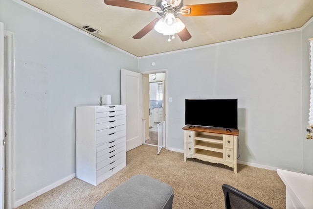 interior space featuring visible vents, ornamental molding, baseboards, ceiling fan, and carpet