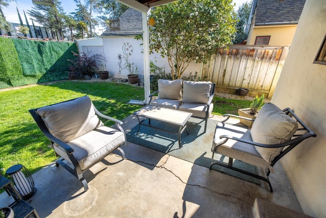 view of patio with outdoor lounge area and a fenced backyard