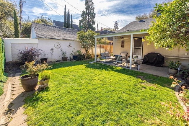 view of yard featuring a patio, ceiling fan, and fence