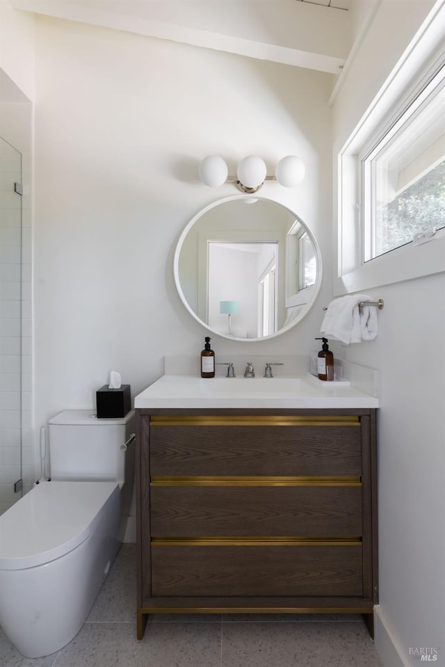 bathroom featuring vanity and toilet