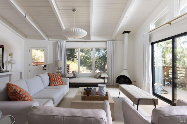 living room with vaulted ceiling with beams