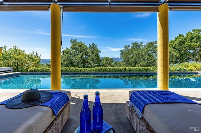 outdoor pool with an outdoor hangout area