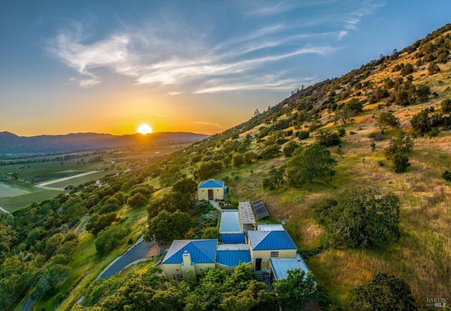 aerial view at dusk with a mountain view