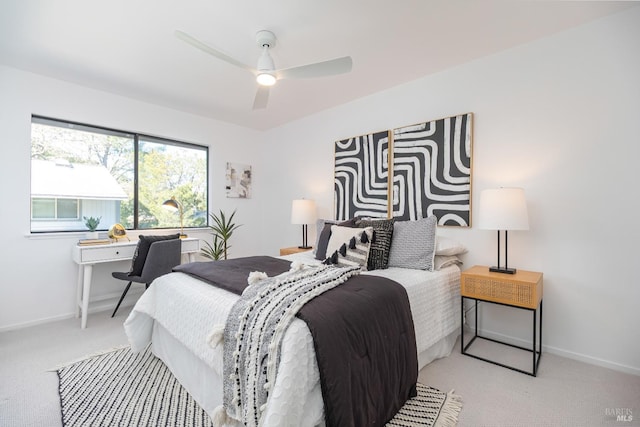 carpeted bedroom featuring ceiling fan and baseboards