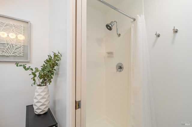 bathroom with a shower with curtain