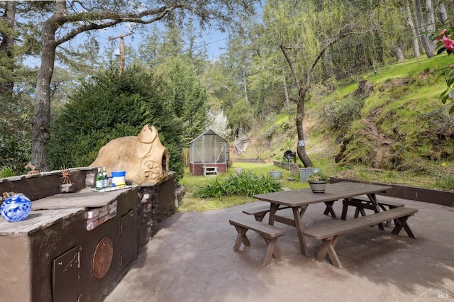 224 Arroyo Rd, Forest Knolls, CA 94933 - view of patio / terrace featuring an outbuilding, exterior kitchen, outdoor dining area, and an exterior structure