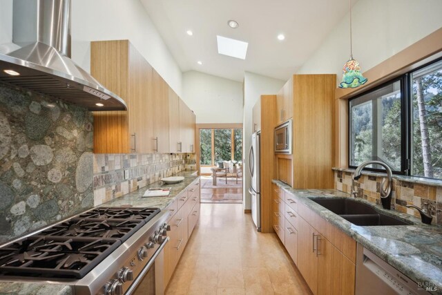 224 Arroyo Rd, Forest Knolls, CA 94933 - kitchen featuring a skylight, stainless steel appliances, a sink, light stone countertops, and wall chimney exhaust hood