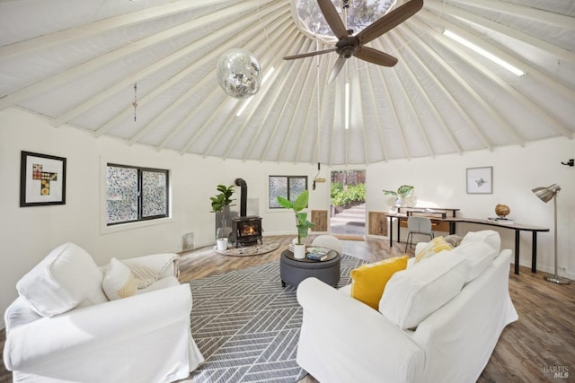 224 Arroyo Rd, Forest Knolls, CA 94933 - living room featuring ceiling fan, high vaulted ceiling, wood finished floors, beamed ceiling, and a wood stove